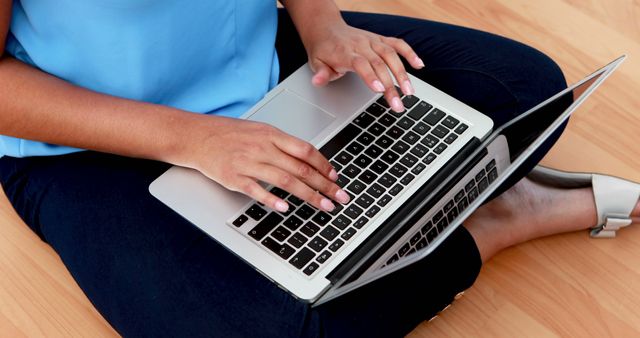 Person Typing on Laptop Sitting on Wooden Floor - Download Free Stock Images Pikwizard.com