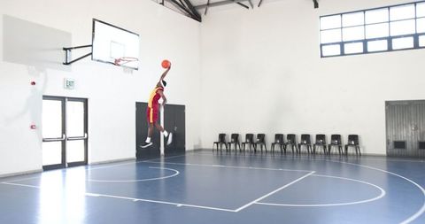 Athlete Dunking basketball on Indoor Court Action Motion