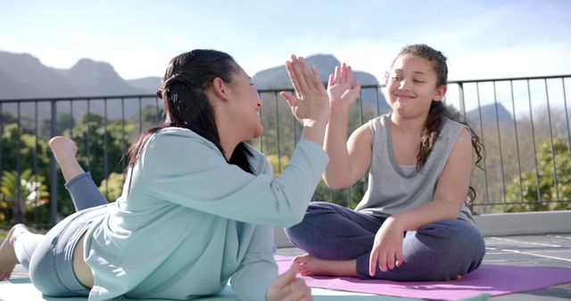 Mother and Daughter Celebrating After Outdoor Enthusiastic Yoga Session - Download Free Stock Images Pikwizard.com