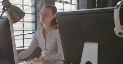 Caucasian Businesswoman Working at Computer in Bright Modern Office - Download Free Stock Images Pikwizard.com