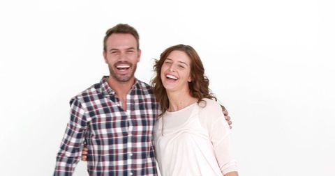 Joyful Caucasian Couple Laughing in Casual Attire with Copy Space