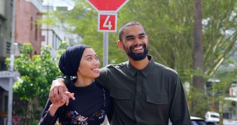 Interracial Couple Enjoying Urban Walk Smiling