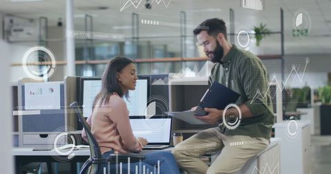 Colleagues Discussing Data Patterns in Modern Office