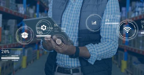Modern warehouse manager using tablet with holographic interface