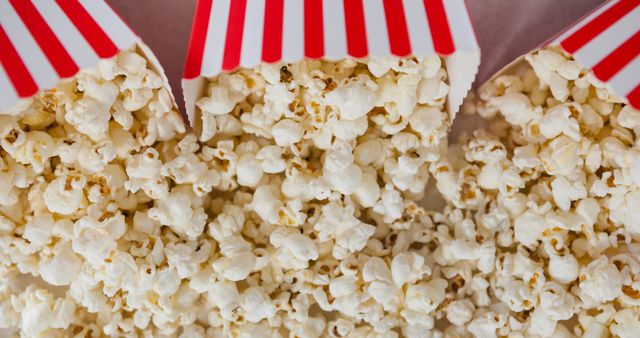 Close-up of Popcorn in Striped Cardboard Containers - Download Free Stock Images Pikwizard.com