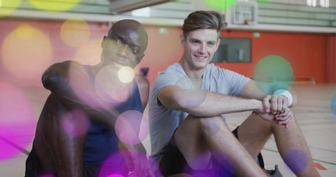 Resting Basketball Players on Indoor Court with Abstract Overlay