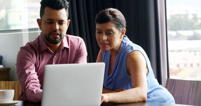 Two Colleagues Collaborating on Laptop in Cozy Office - Download Free Stock Images Pikwizard.com