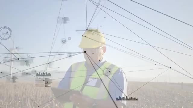 Field Engineer Analyzing Wind Turbine Data Via Tablet Technology