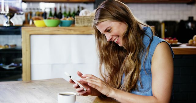 Smiling Woman Texting on Smartphone in Coffee Shop - Download Free Stock Images Pikwizard.com