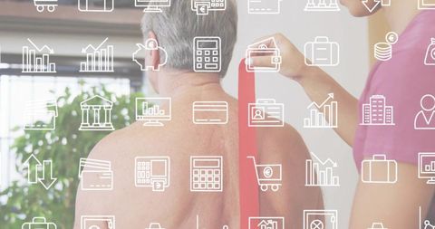 Senior man receiving resistance band therapy from caregiver with finance icon overlay