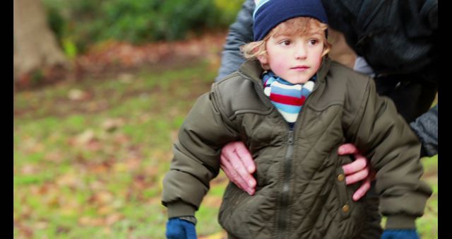 Young Child Wearing Winter Jacket Playing Outdoors - Download Free Stock Images Pikwizard.com