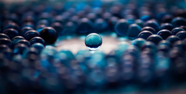 Single Transparent Marble Among Many Blurred Blue Marbles - Download Free Stock Photos Pikwizard.com
