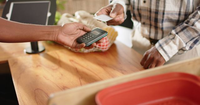 Close-up of Contactless Payment in a Market Stall - Download Free Stock Images Pikwizard.com