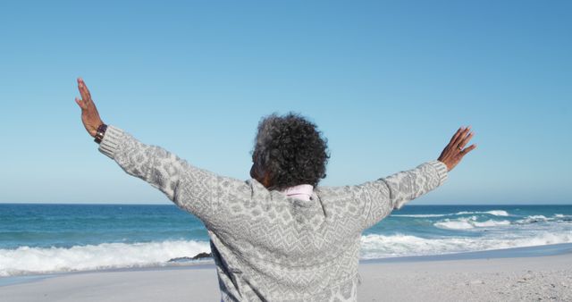 Relaxing Elderly Woman Enjoying Open Sea View on a Sunny Day - Download Free Stock Images Pikwizard.com