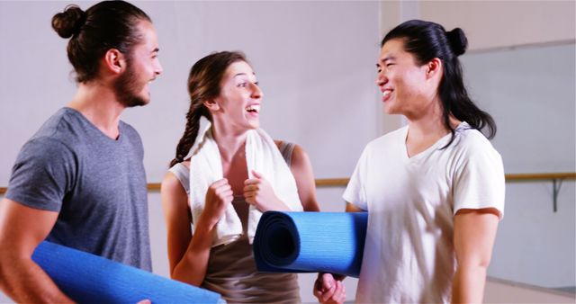 Friends Smiling and Holding Blue Yoga Mats After Class - Download Free Stock Images Pikwizard.com