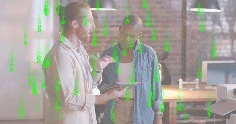 Colleagues collaborating over tablet in loft office with green binary data overlay