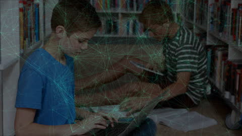 Digital Learning: Boys with Laptop and Books in Modern Library