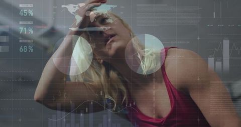 Tired athlete in gym with digital analytics overlay