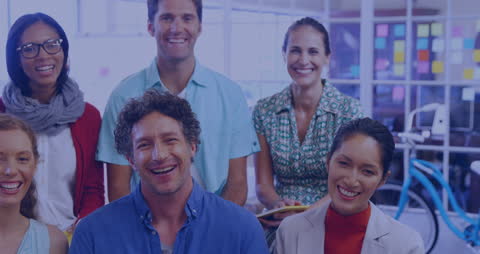 Smiling Diverse Team in Modern Office Setting Collaborating