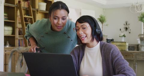 Joyful Sisters Bonding Over Laptop Indoors - Download Free Stock Images Pikwizard.com
