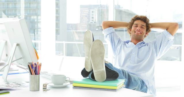 Relaxed Young Man Taking Break in Modern Office - Download Free Stock Images Pikwizard.com