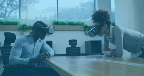 Coworkers Engaging with Virtual Reality Technology in Modern Office