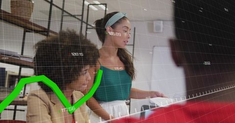 Colleagues Analyzing Financial Data in Office Meeting