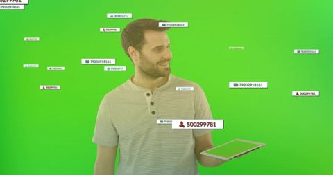 Man interacting with technology interfaces in green background