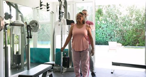 Senior Couple Exercising at Home with Resistance Bands