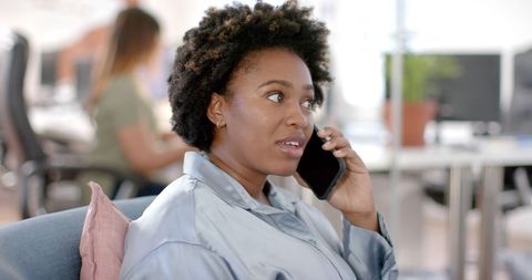 African American Businesswoman on Phone in Modern Office - Download Free Stock Images Pikwizard.com
