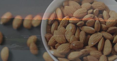 Bowl of Organic Raw Almonds on Dark Surface for Healthy Lifestyle