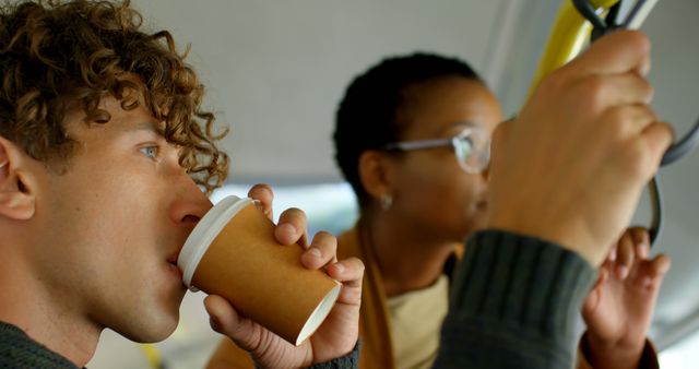 Two Commuters Enjoying Coffee on Public Transport - Download Free Stock Images Pikwizard.com