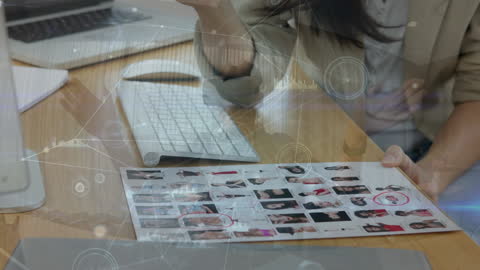 Businesswoman Analyzing Digital Data Insights on Desk Screen