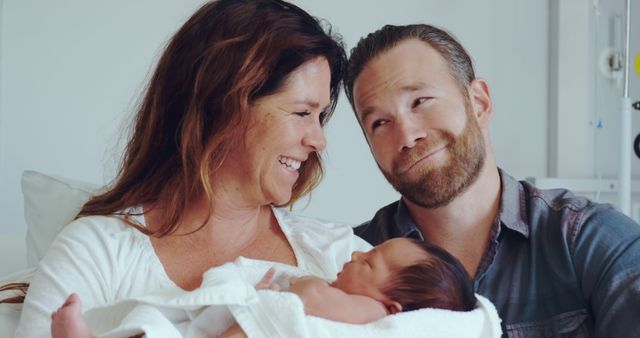 Happy Parents Holding Newborn Baby in Hospital Room - Download Free Stock Images Pikwizard.com