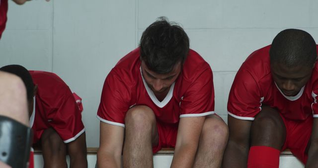 Soccer Players Tying Shoes in Locker Room Before Game - Download Free Stock Images Pikwizard.com