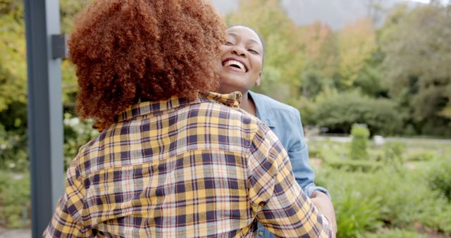 Friends Embracing in Park on Sunny Day with Joyful Smiles - Download Free Stock Images Pikwizard.com