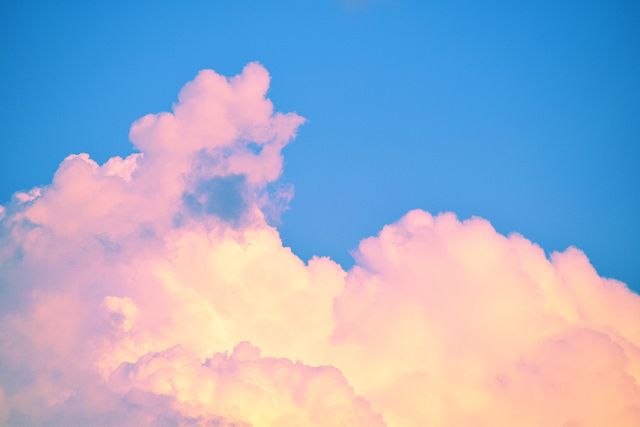 Fluffy Pink Clouds in Clear Blue Sky During Sunset - Download Free Stock Photos Pikwizard.com