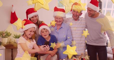 Family Celebrating Christmas with Santa Hats and Smartphone Selfie - Download Free Stock Images Pikwizard.com