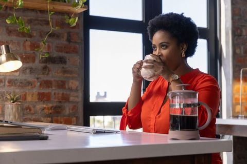 Woman Sipping Coffee in Home Office, Rustic Modern Workspace