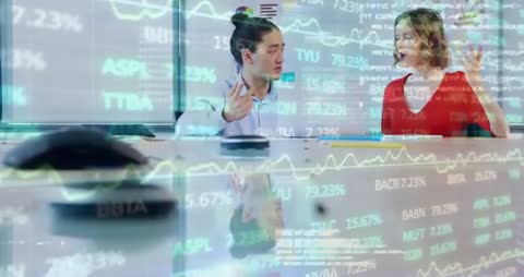 Business Colleagues Analyzing Financial Data in Corporate Environment