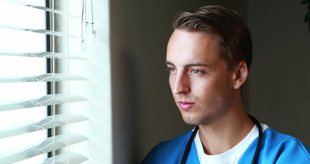 Pensive Young Nurse Looking Out Window - Download Free Stock Images Pikwizard.com