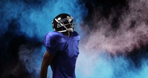 Confident American Football Player with Dramatic Smoke Effect