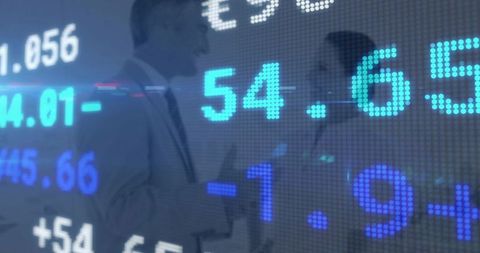 Digital stock ticker overlaying professionals negotiating in boardroom with led numbers