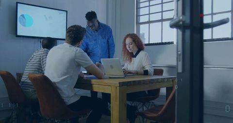 Diverse Team Brainstorming in Modern Conference Room