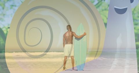 Man Holding Surfboard on Idyllic Beach Looking at Ocean