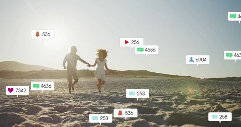 Couple Running on Beach with Floating Social Media Icons