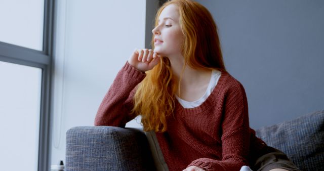 Relaxed Young Woman Enjoying Peaceful Moment by Window at Home - Download Free Stock Images Pikwizard.com