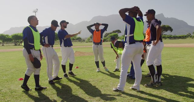 Baseball Team Practicing with Coach Giving Instructions - Download Free Stock Images Pikwizard.com