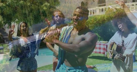 Clapping Man Dancing at Backyard Pool Party while Friends Singing and Guitarist Playing