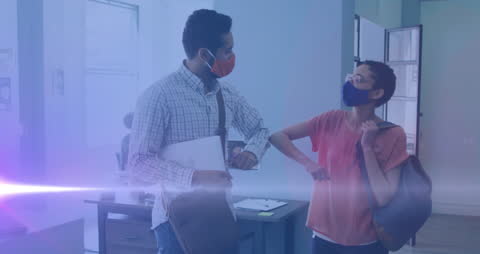 Diverse Professionals Greeting with Elbow Bump in Modern Office